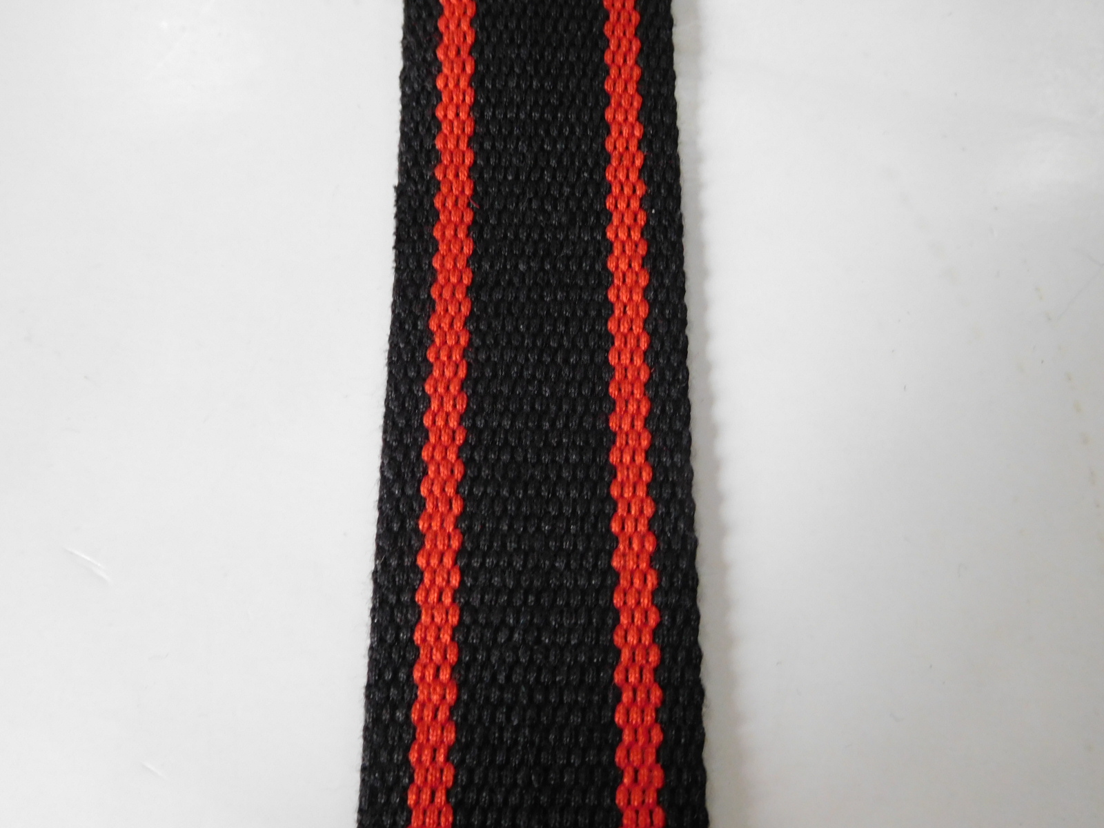 Secondary color aramid fiber webbing for fire safety