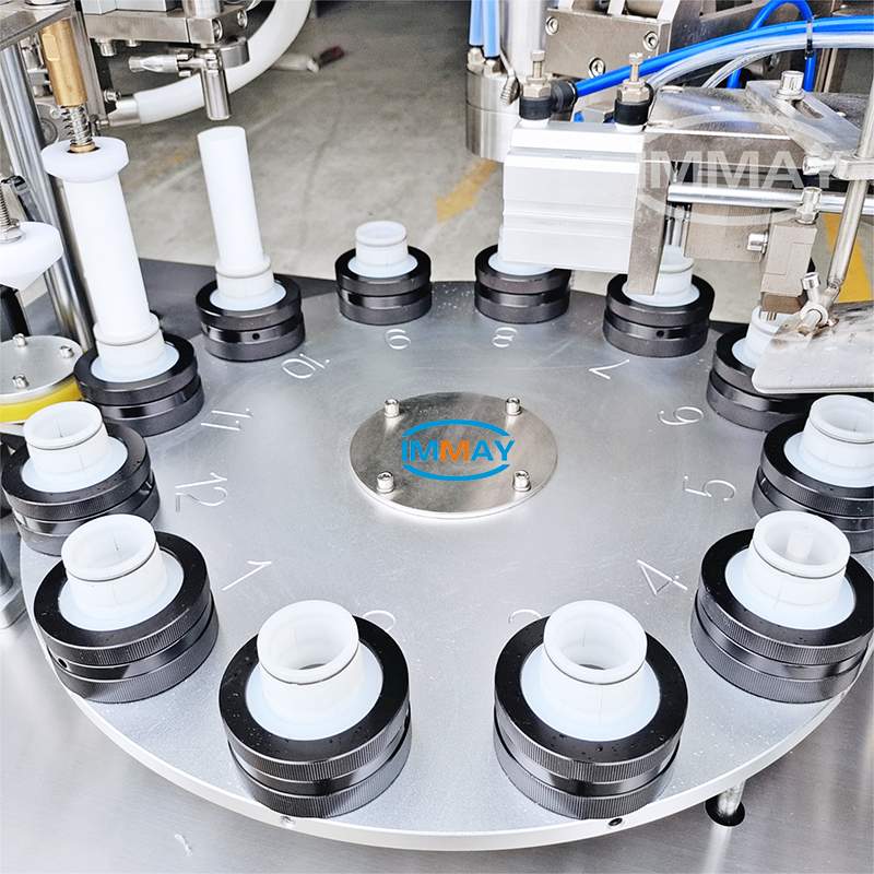 Toothpaste tube filler and sealing machine Riempitrice e sigillatrice per tubetti di dentifricio