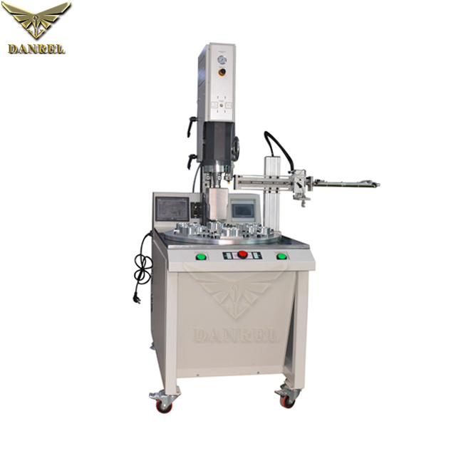 China High Speed Plastic Sonic Welder, Rotary Table Ultrasonic PP Pacifier Welding Machine with Unloader and Film Feeder